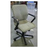 Adjustable rolling office chair in checkerboard