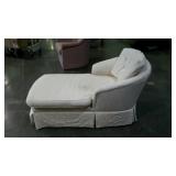 Upholstered chaise lounger with tufted back