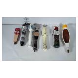 Seven beer tap handles,  all in good condition.
