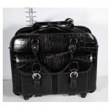 Small travel luggage with laptop compartment.