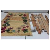 Early unfinished hook rug with unassembled rack,