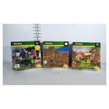 Three 1,000 piece John Deere puzzles. Not sure if