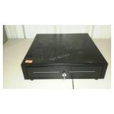 Lockable, spring-loaded cash drawer, with key.