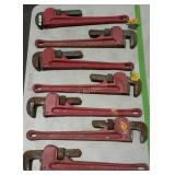 Seven 18" OLYMPIC pipe wrenches, some with tags.