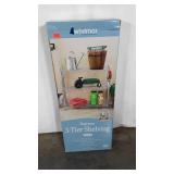 Three tier metal shelving unit in chrome finish,