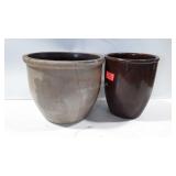 Two pottery crocks, one has large crack