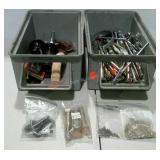 Two stackable bins of assorted hardware. Bolts,