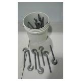 Bucket with more than thirty hook end bolts, 8"