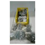 Stackable bin full of bags of nuts, bolts and