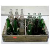 Wooden bottle crate with an assortment of soda