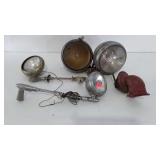 Older car headlights and spotlights with arms,