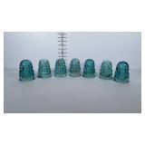 7 blue glass insulators.