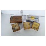 Cardboard cigar boxes. Lid on one is detached.