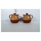 2 matching Cabin Art Bakeware pitchers /