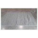 Bound green area rug, 71x103