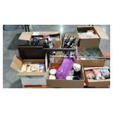 VHS tapes, hangers, dishes, books, mugs, vacuum,