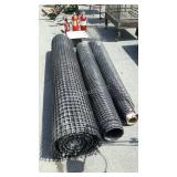 Three partial rolls of construction fence