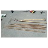 Long-handled tools with Sledgehammer, pitchfork,