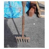 Metal fork on extremely long pole