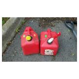 Two poly gas cans . Two gallons each.