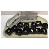Tray of costume jewelry rings and three charm