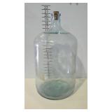 Five gallon glass water bottle with cork.
