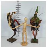 Paper mache figures and an artist