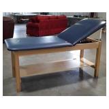 Examination / massage table with adjustable back,