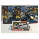Two Batman artist pads and a musical police car