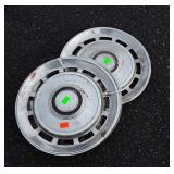 Three Automobile Hubcaps