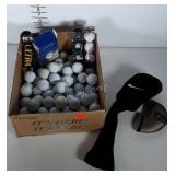 Box of golfballs. Most are used with a few new