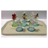 Eight plastic bells with birds