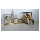 Lot of gold toned clocks including a Howard