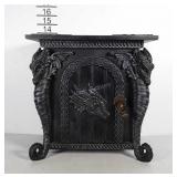Small cabinet with dragon head on door and dragon