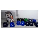 Miniature baseball helmets (one is cracked) and a