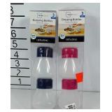 Six poly dressing bottles