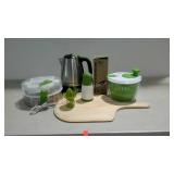 Kitchen wares, mostly new and shades of green.