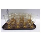 Yellow glassware stemmed glasses,  mixed shapes