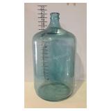 Five gallon blue glass water bottle. Marked GPD.