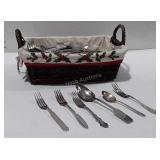 Basket with flatware.  Mixed patterns and makers