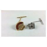 Two tie tacks
