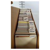 Box of baseball cards organized by team.