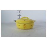 Enamel covered cast iron casserole dish with lid.