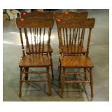 Four oak pressed back chairs. All in nice