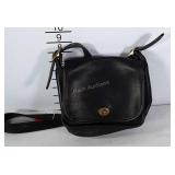 Small black Coach leather purse. Leather is in