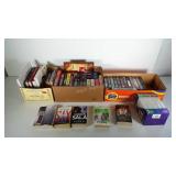 Books and VHS tapes, plus a box of tape cases