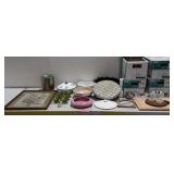 Calendar print, pottery planter, green glass