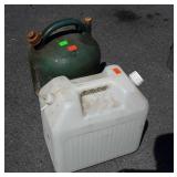 Two poly Containers, kerosene, and water