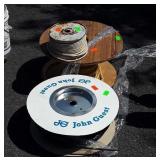 Three partial spools of electronics type cable