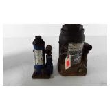 Two hydraulic jacks,  no handles, one is marked